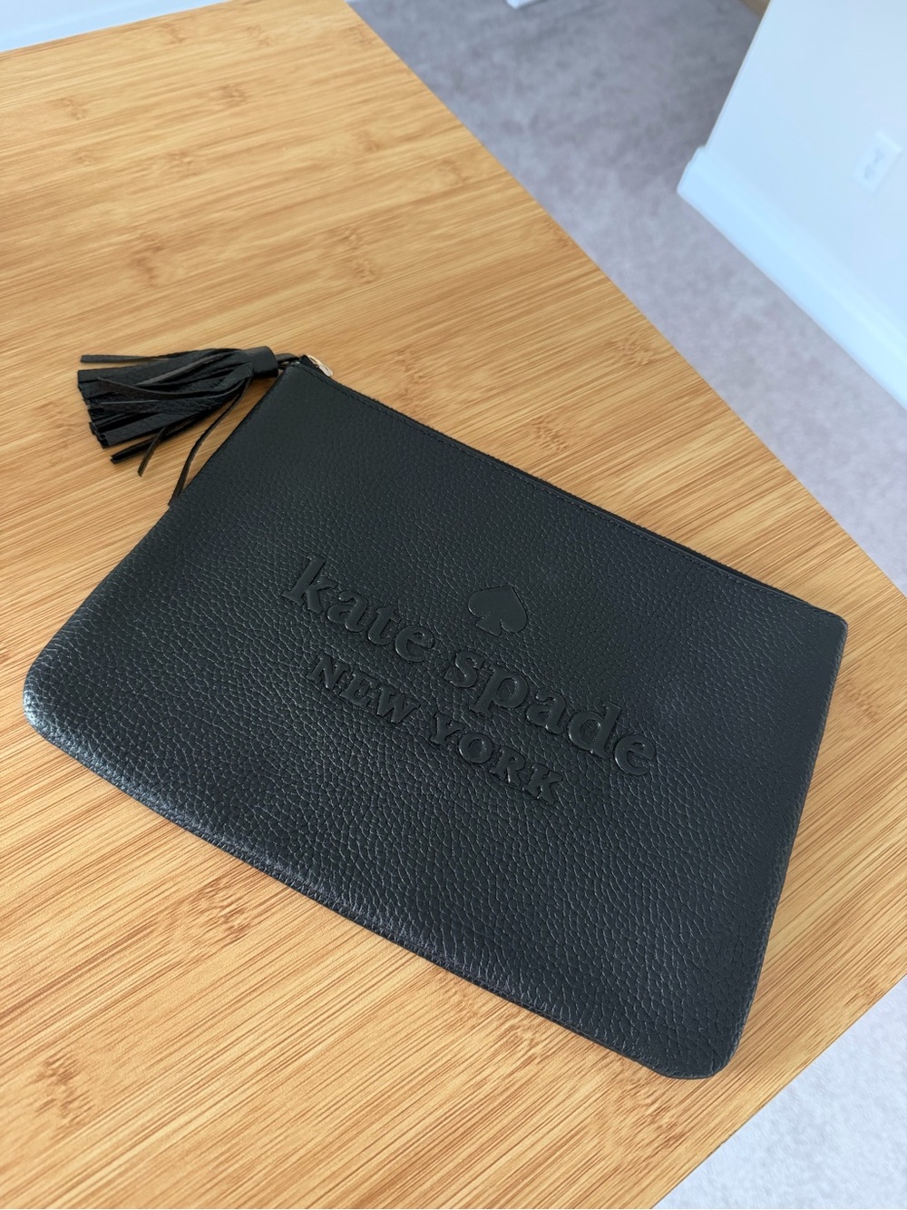 kate spade black pebbled leather tassel zip pouch